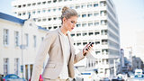 Focused gorgeous businesswoman text messaging