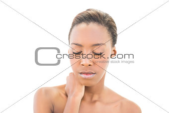Natural beauty with hand on neck and closed eyes