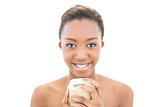 Smiling natural beauty holding coffee cup