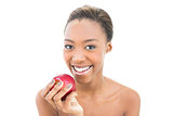 Smiling natural beauty holding red apple