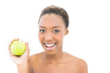 Smiling beauty holding green apple
