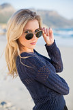 Attractive casual blonde looking over her sunglasses