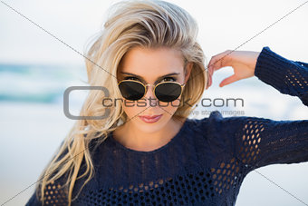 Gorgeous sensual blonde looking over her sunglasses