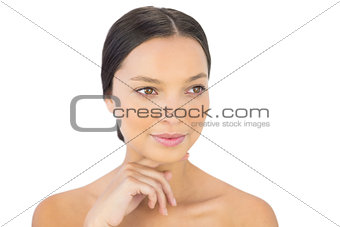 Peaceful woman holding hand under chin