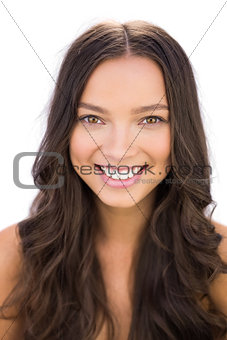 Beautiful young brunette smiling at camera