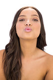 Attractive woman blowing an air kiss