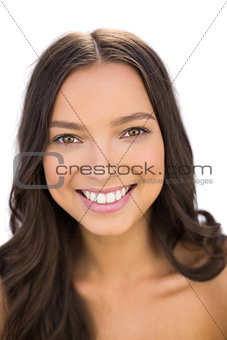 Happy natural brunette smiling at camera