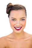 Gorgeous woman with red lips smiling at camera