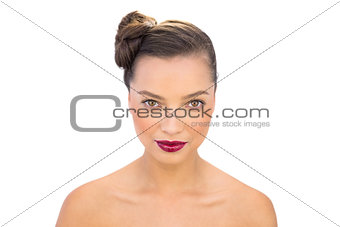 Glamorous woman with red lips looking at camera