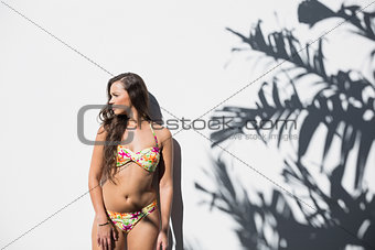 Sexy woman in flowery bikini posing
