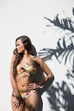 Sexy gorgeous woman in flowery bikini posing