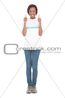 Woman wearing volunteer tshirt giving thumbs up