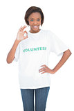 Pretty woman with volunteer tshirt making okay gesture