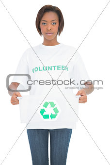 Serious woman holding recycling crate