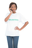 Thoughtful cute volunteer having a phone call