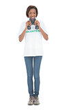 Smiling volunteer woman using binoculars