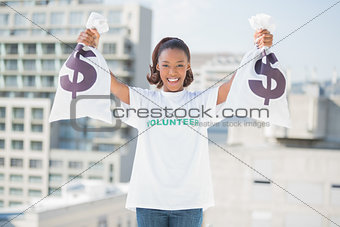 Happy volunteer woman holding money bags