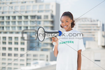 Happy volunteer woman holding megaphone