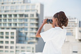 Volunteer woman using binoculars