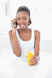 Cheerful woman calling with her mobile phone