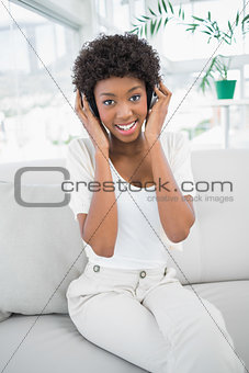 Smiling pretty woman listening to music