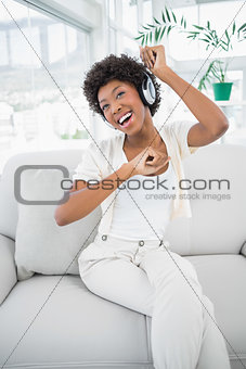 Pretty woman enjoying listening to music