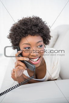 Happy gorgeous brunette on the phone