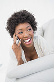 Cheerful attractive brunette having a phone call