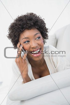 Cheerful attractive brunette having a phone call