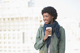 Cheerful casual model holding coffee