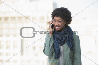 Cheerful afro model on the phone