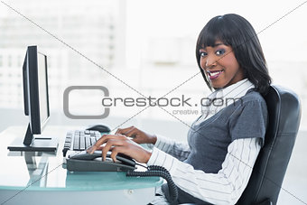 Smiling gorgeous businesswoman working