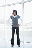 Businesswoman standing in bright office