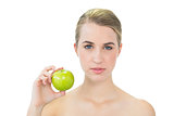 Attractive blonde holding green apple