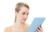 Content attractive blonde using tablet pc