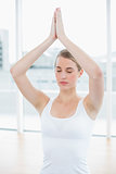 Relaxed fit woman doing yoga session