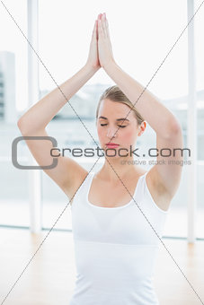 Relaxed fit woman doing yoga session
