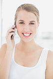 Close up on happy sporty woman having a phone call