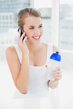 Smiling blond woman having a phone call