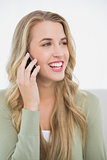Smiling pretty blonde on the phone