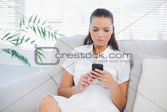 Peaceful pretty woman text messaging