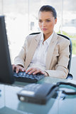Focused businesswoman working on computer