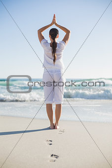 Rear view of gorgeous woman in yoga pose