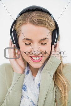 Happy cute blonde listening to music