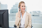 Happy attractive businesswoman on the phone