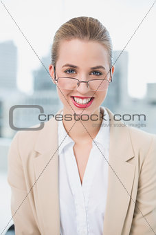 Smiling businesswoman with glasses posing
