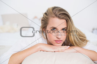 Relaxed gorgeous model lying on her bed