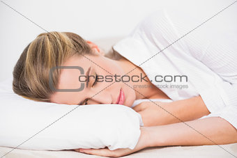 Cute model sleeping in cosy bed