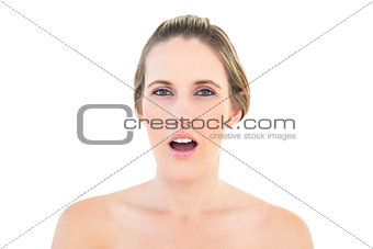 Portrait of shocked woman looking at camera