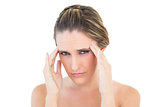 Portrait of upset woman with a headache